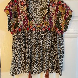 Fun and flowy shirt with tassels. Purchased in a small local boutique. Size SM